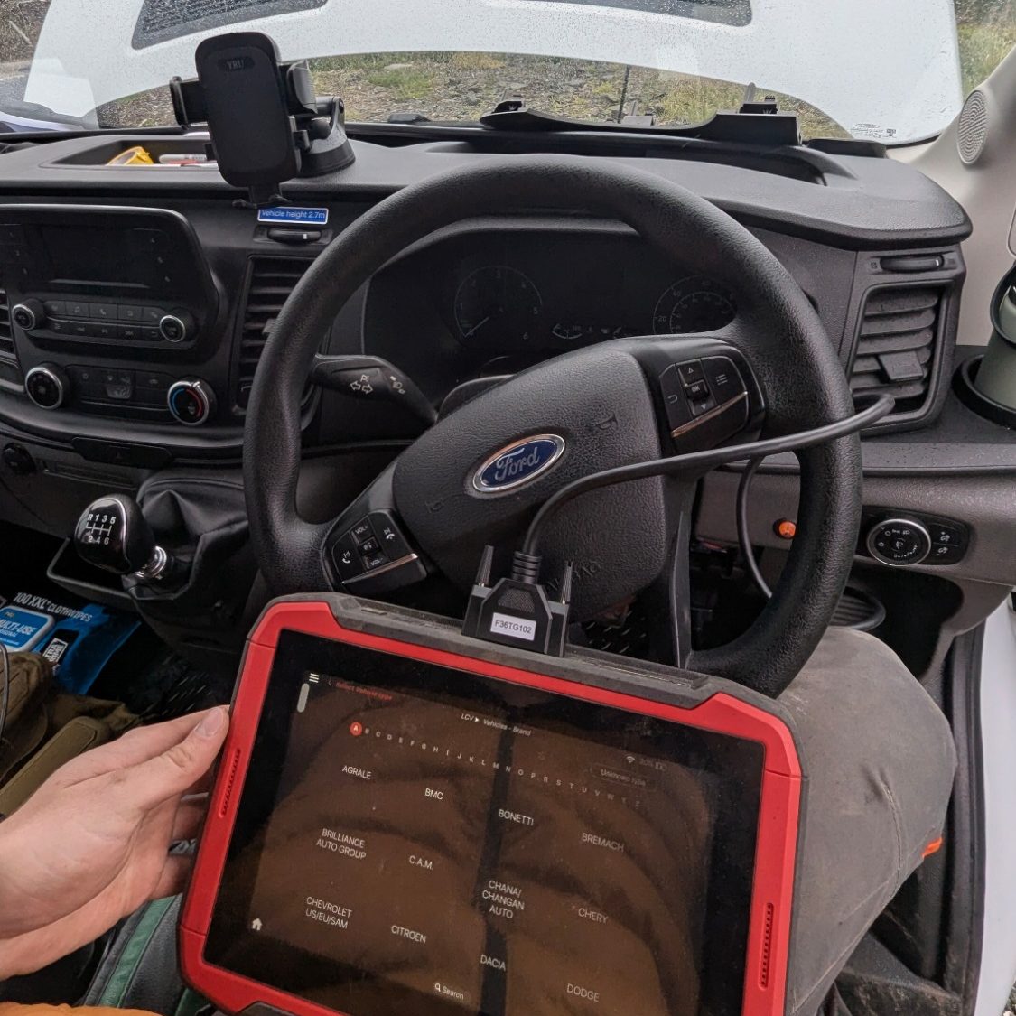 mobile-car-electrical-fault-diagnostics-fife An on-site photograph of the silver AJ AGRI Mercedes mobile diagnostic van parked on a driveway in Fife with its side door open, displaying